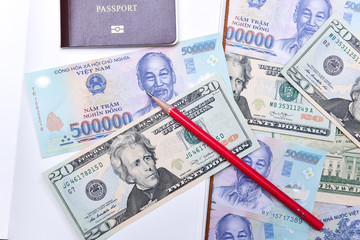 Vietnam and US dollar currency, notebook and passport
