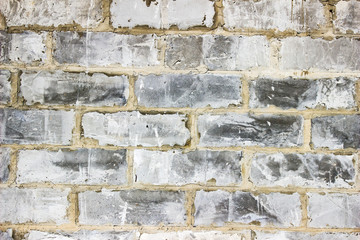 Wall of concrete blocks, background in masonry