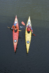 Traveling by kayak on the river on a sunny day.