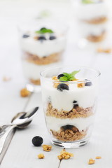 Delicious homemade dessert granola and blueberry yogurt parfait