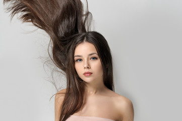 Naklejka premium Long brown hair go up