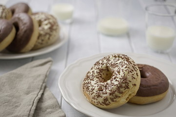 Sweet homemade dessert donuts with white and milk chocolate