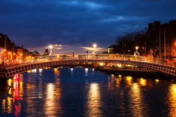 Fototapeta na wymiar Dublin, Ireland. Night view of famous Ha Penny bridge