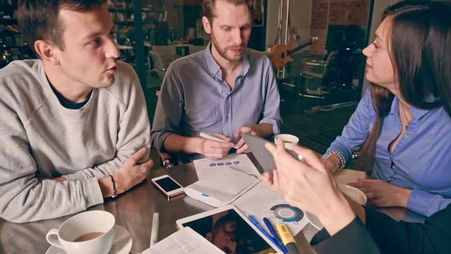 Group of young people in business meeting showing teamwork. Startup