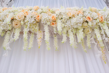 beautiful arch with white roses for wedding ceremony