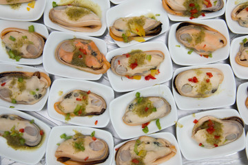 Mussel apply spicy sauce  close up