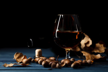 glass with whiskey on wooden table