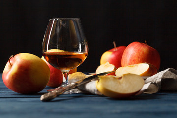 glasse of Calvados Brandy and red apples - obrazy, fototapety, plakaty