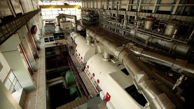 A turbine generator in the engine room of a nuclear power plant. HD