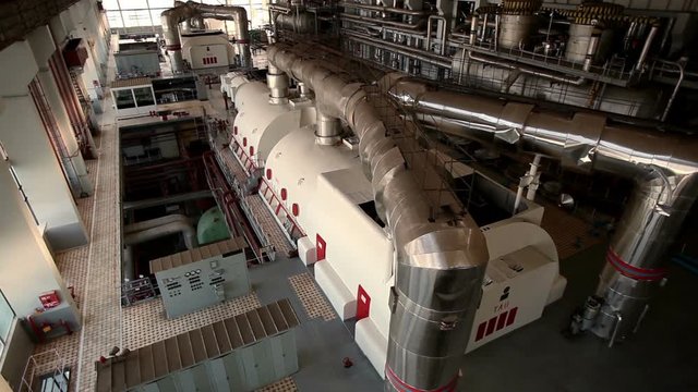 A turbine generator in the engine room of a nuclear power plant. HD