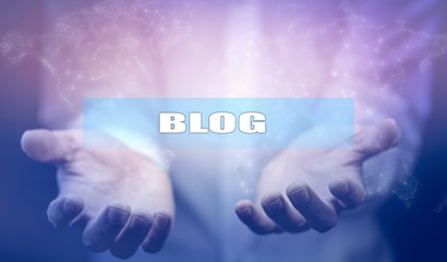 Blog text on screen on man hand