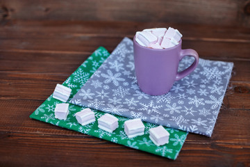 marshmallow coffee in the background. Christmas concept, life