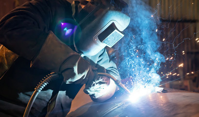 Semi-automatic welding with sparks and smoke