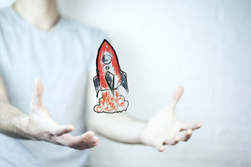 business man hand holding drawn rad racket © ARAMYAN