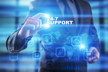 Businessman selecting 24-7 support on virtual screen.