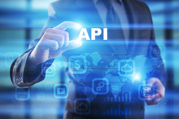 Businessman selecting api on virtual screen.
