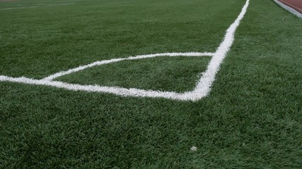 Fototapeta premium football Soccer field corner with green sport artificial grass