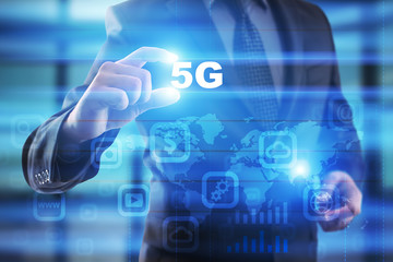 Businessman selecting 5g on virtual screen.