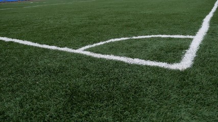 Obraz premium football Soccer field corner with green artificial sport grass