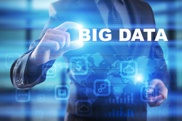 Businessman selecting big data on virtual screen.