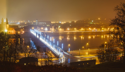 Fototapeta na wymiar Misty night view of Kaunas from Aleksotas hill, Lithuania