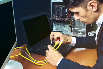 man in suit holding network cables concept is the connection
