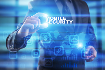 Businessman selecting mobile security on virtual screen.