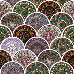 Colorful floral seamless pattern from circles with mandala in patchwork boho chic style, in portuguese and moroccan motif
