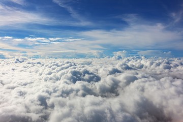 Naklejka na ściany i meble Top view of the cloud photo taking from airplane window