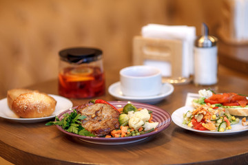 Grilled steak with vegetables and herbs on plate