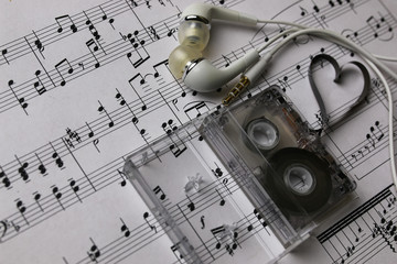 notes background and headphones