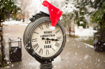 vintage clock with santa hat and words Merry Christmas New York