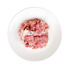 meat slices pork on dish isolated on white background