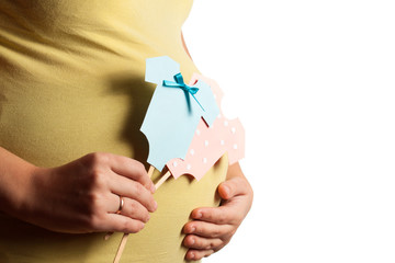 Image of pregnant woman touching her belly with hands