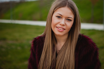 Pretty blonde girl with fur coat