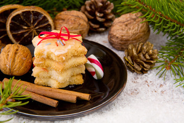 Fototapeta na wymiar Christmas cookies and decoration on snow background.