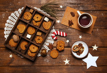 New Year's day breakfast tea with nuts and sugar cane on wooden background