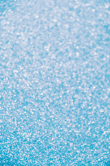 Blue glitter sparkle defocused rays lights bokeh abstract background.