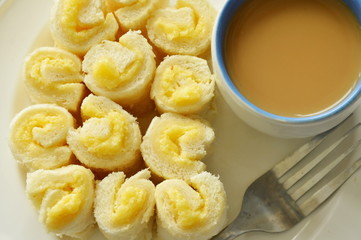 bread filled butter roll eat with coffee on dish