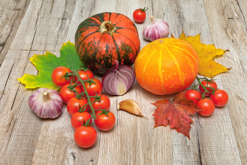 pumpkin and other vegetables on a wooden table