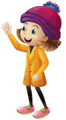 Cute girl in winter clothes waving