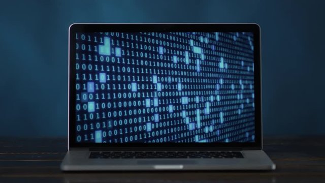 binary code in blue color at laptop