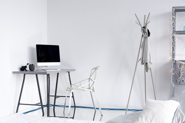 Fototapeta na wymiar Modern study with white walls and furniture