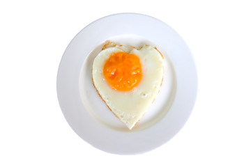 Isolated fried eggs in ideal heart on the white plate on white background