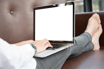 close up women and her laptop with relaxing concept on leather s