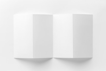 Mockup of opened four fold brochure isolated at white background