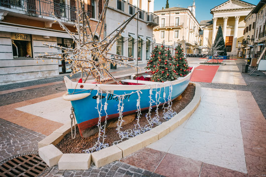 Christmas decorations inside a boat in the historic center of Bardolino, Lake Garda, italy