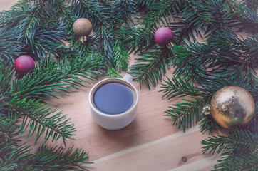 Obraz na płótnie Canvas Coffee on wooden christmas decoration. Retro styling