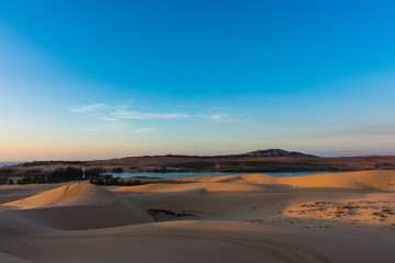 Obraz na płótnie Canvas Sunrise at the white sand dunes in Mui Ne, Vietnam