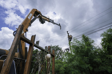 electrician overalls working with crane at height and dangerous.
Electrical and instrument technician just maintenance electric system.